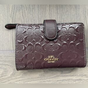 Coach Women's Dark Purple Embossed Wallet